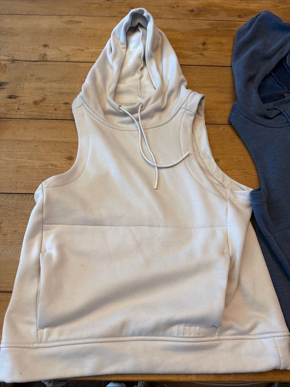 2 NOBULL Sleeveless Hooded Pullover Tank — Cream & Dusty Blue XS